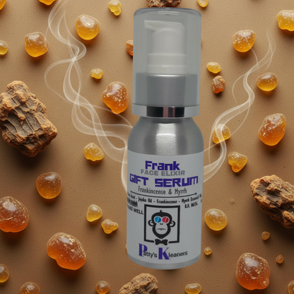 Bottle of Frank Face Elixir Gift Serum with decorative elements on a textured background
