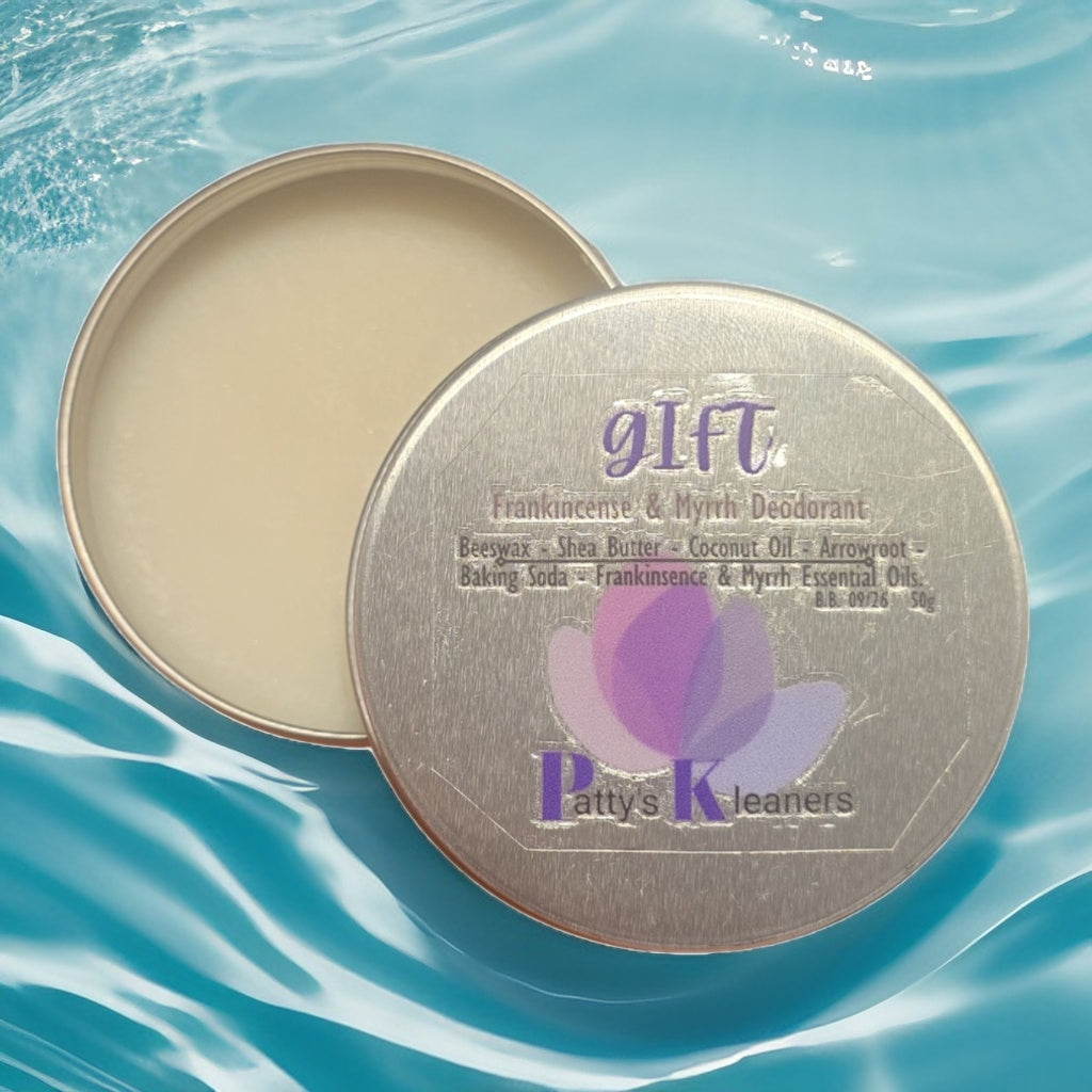 Deodorant tin with lid open on a blue water background